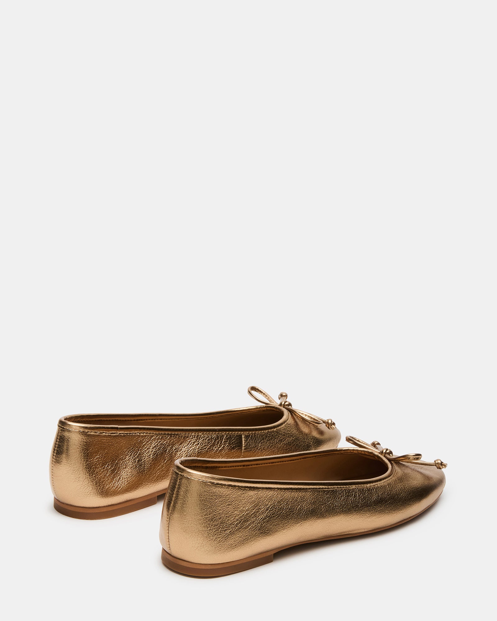 Side profile of black ballet flats showing rounded toe