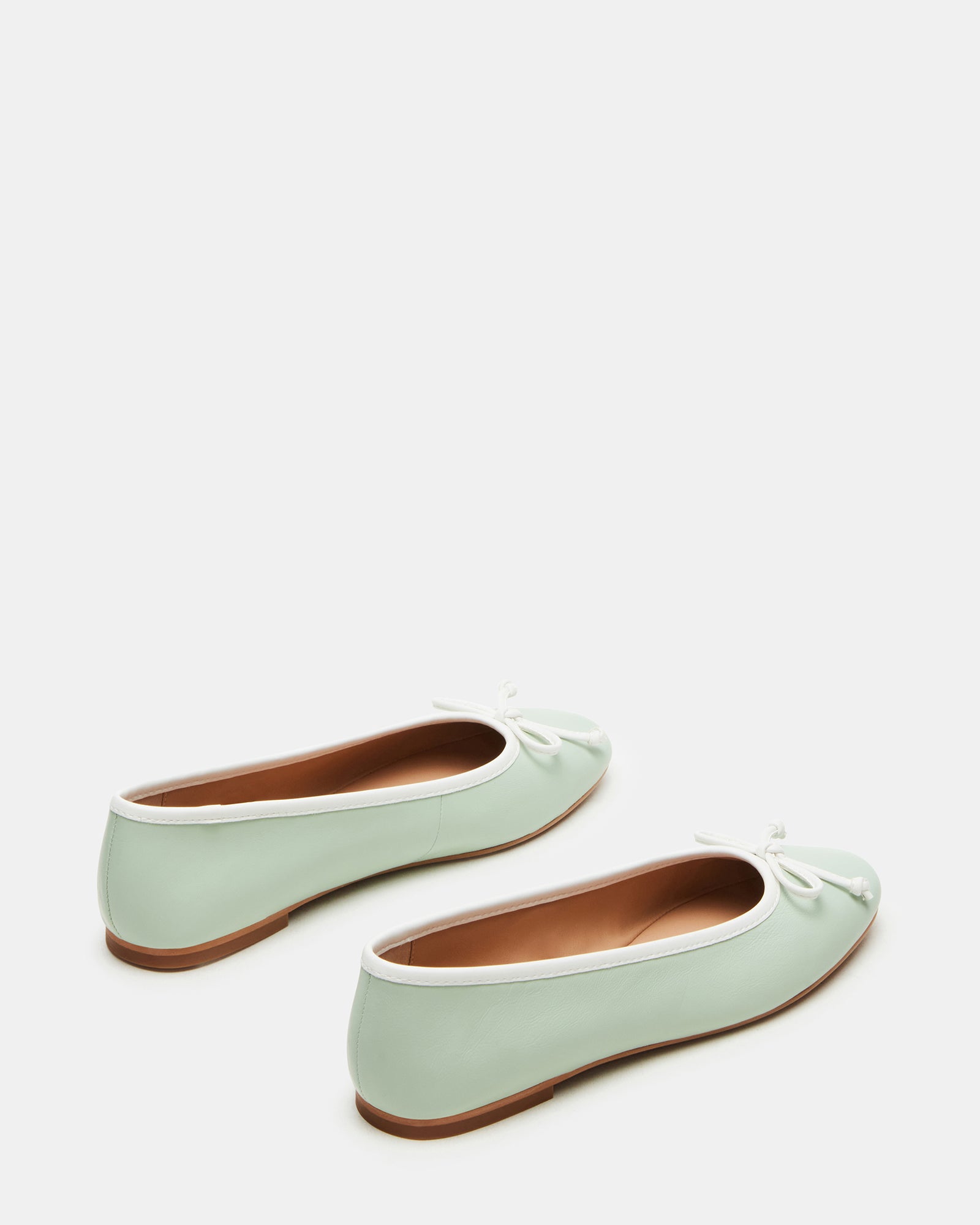 Side view of comfortable ballet flats showing rounded toe design.