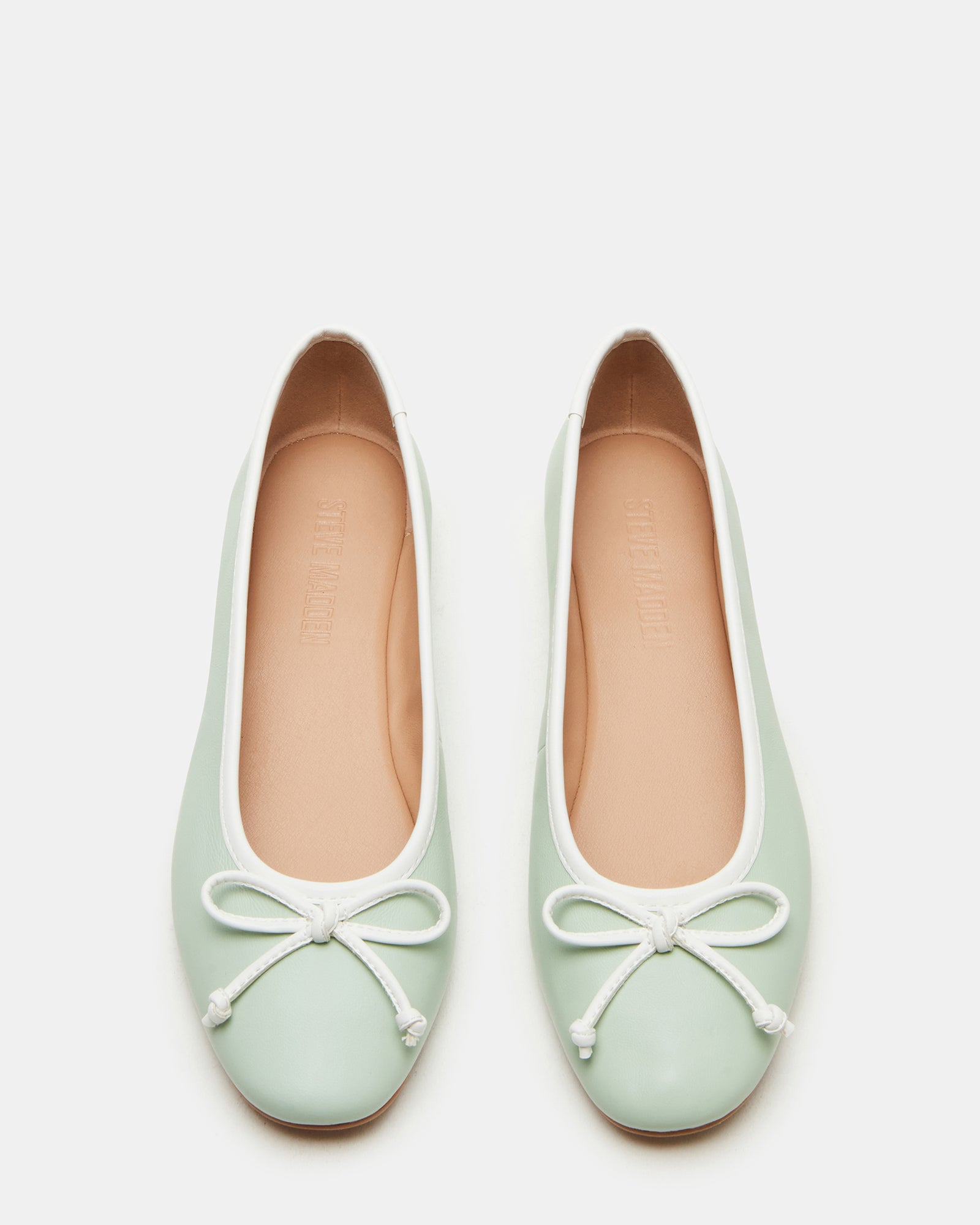 Vixen Pistachio ballet flats with front bow detail, styled with a dress.