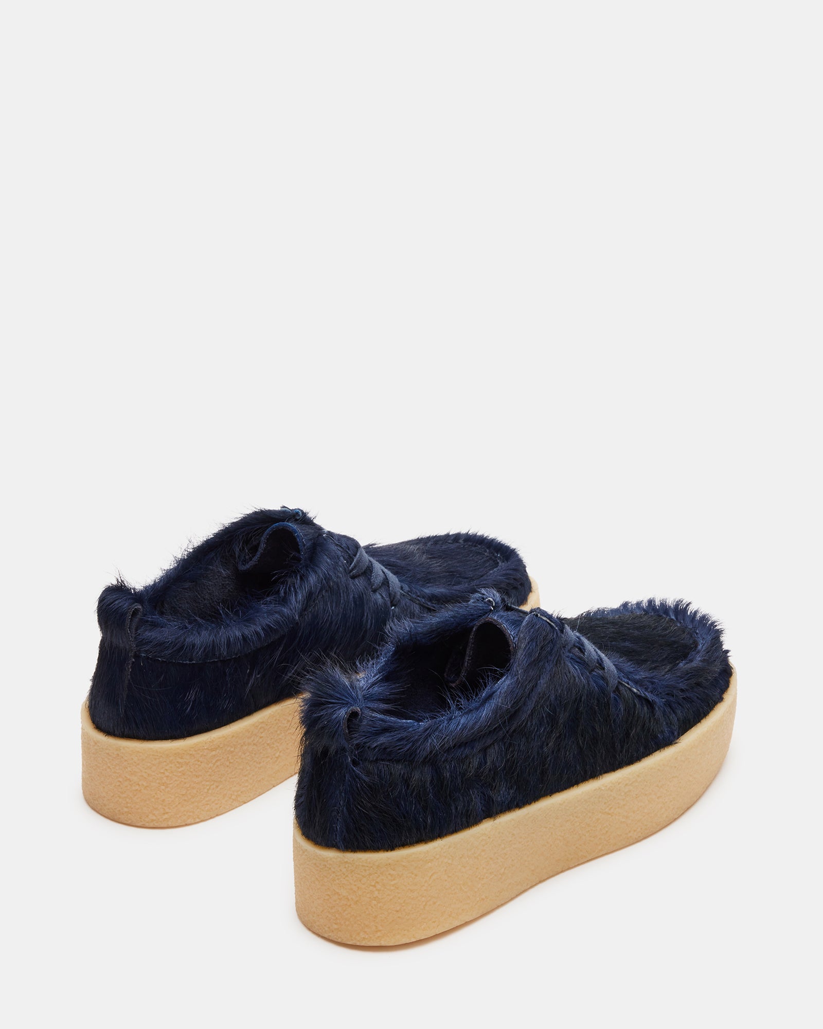 Close-up of hand-stitched leather penny loafer details