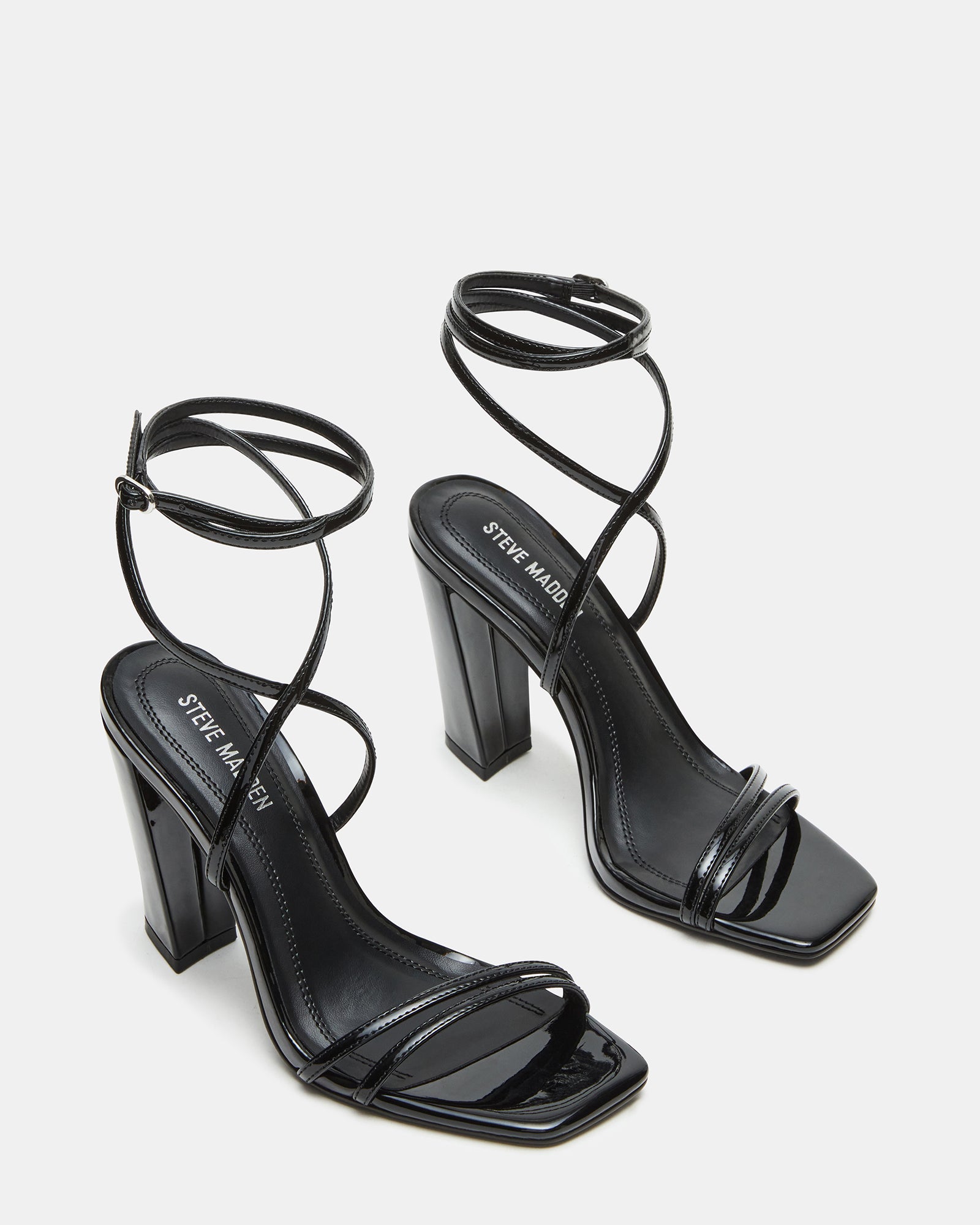 Close-up of crisscross strap detail on womens shoes