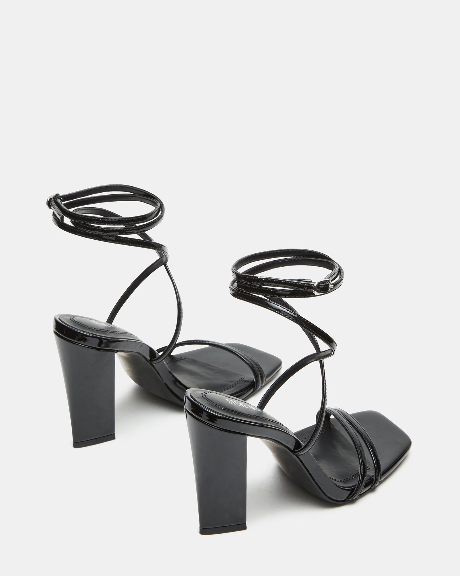 Close-up of crisscross strap detail on womens shoes