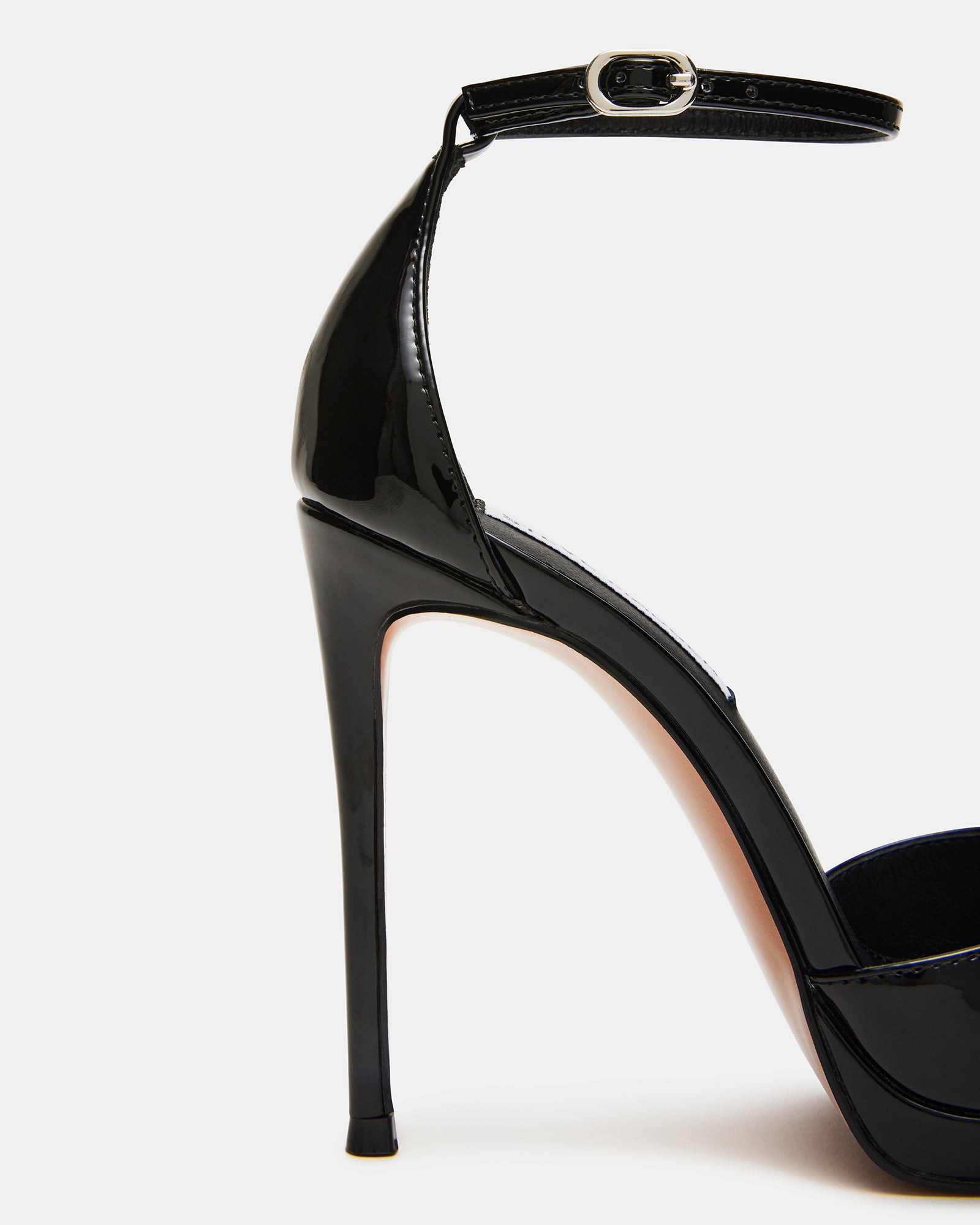 Black patent leather heels with ankle strap, side view