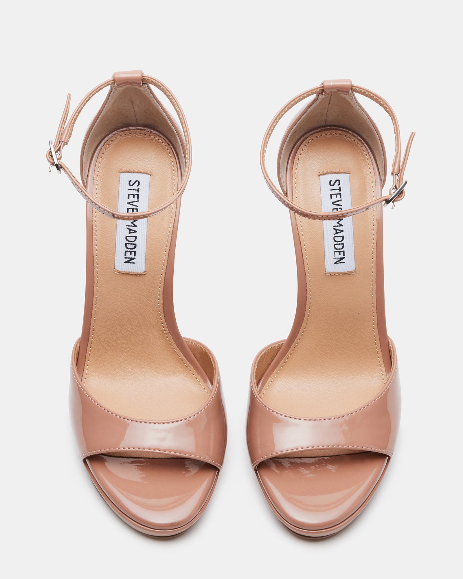 Wiley Blush Patent stiletto heels worn with a classic evening dress.