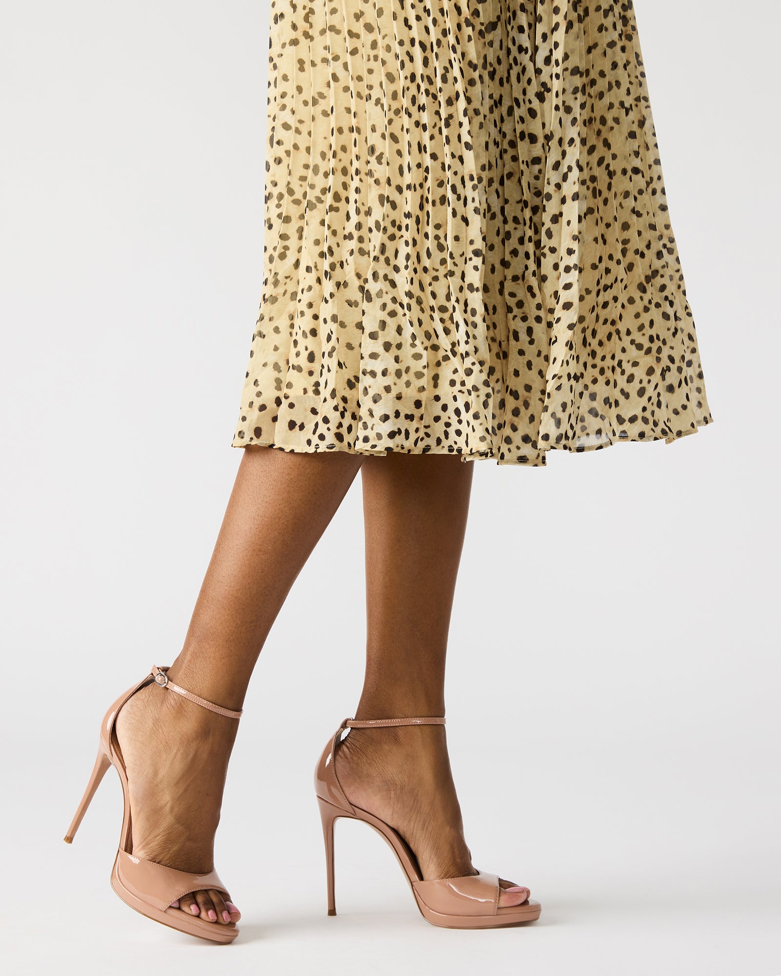 Wiley Blush Patent stiletto heels worn with a classic evening dress.