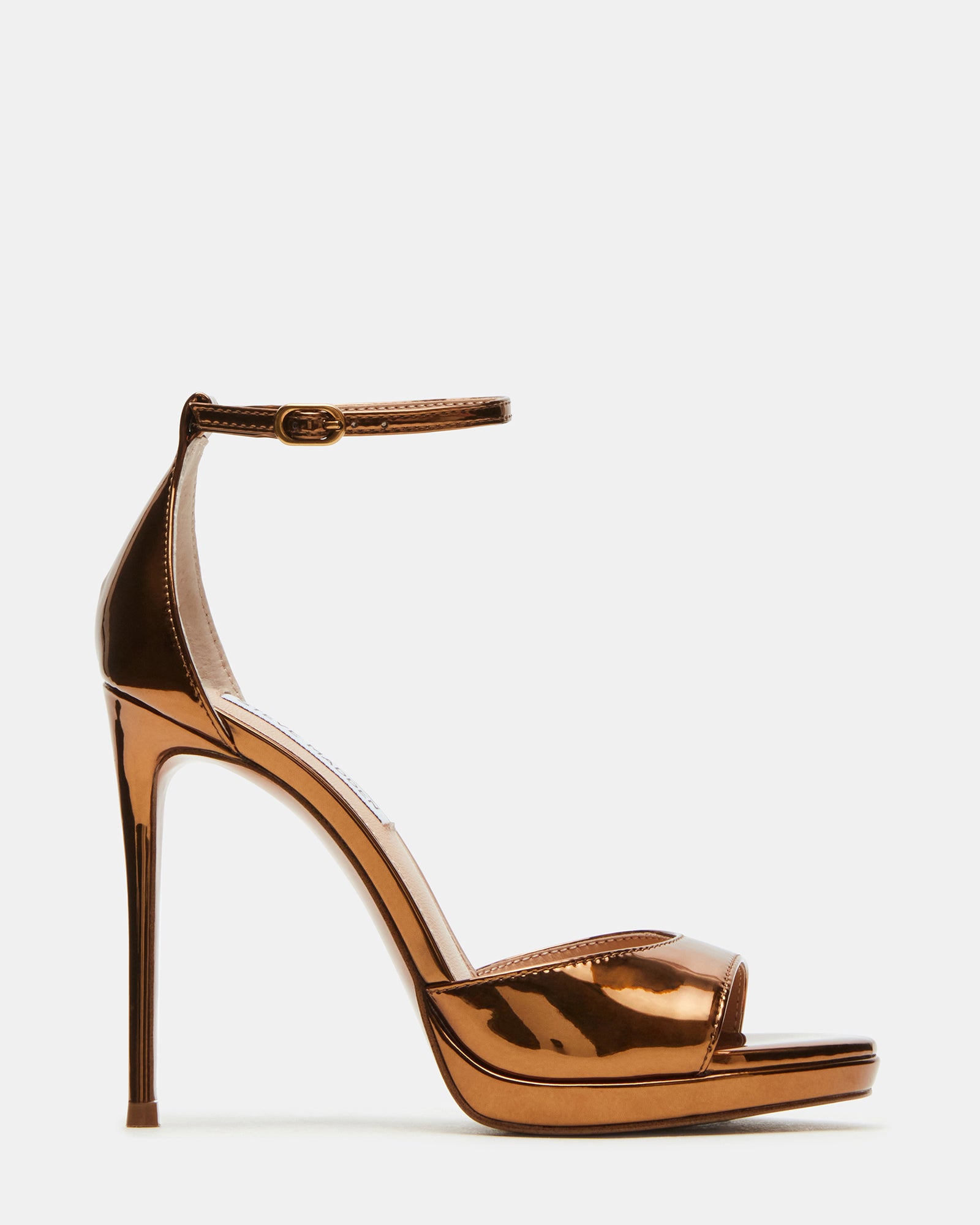 Side view of black stiletto heels with ankle strap on hardwood floor