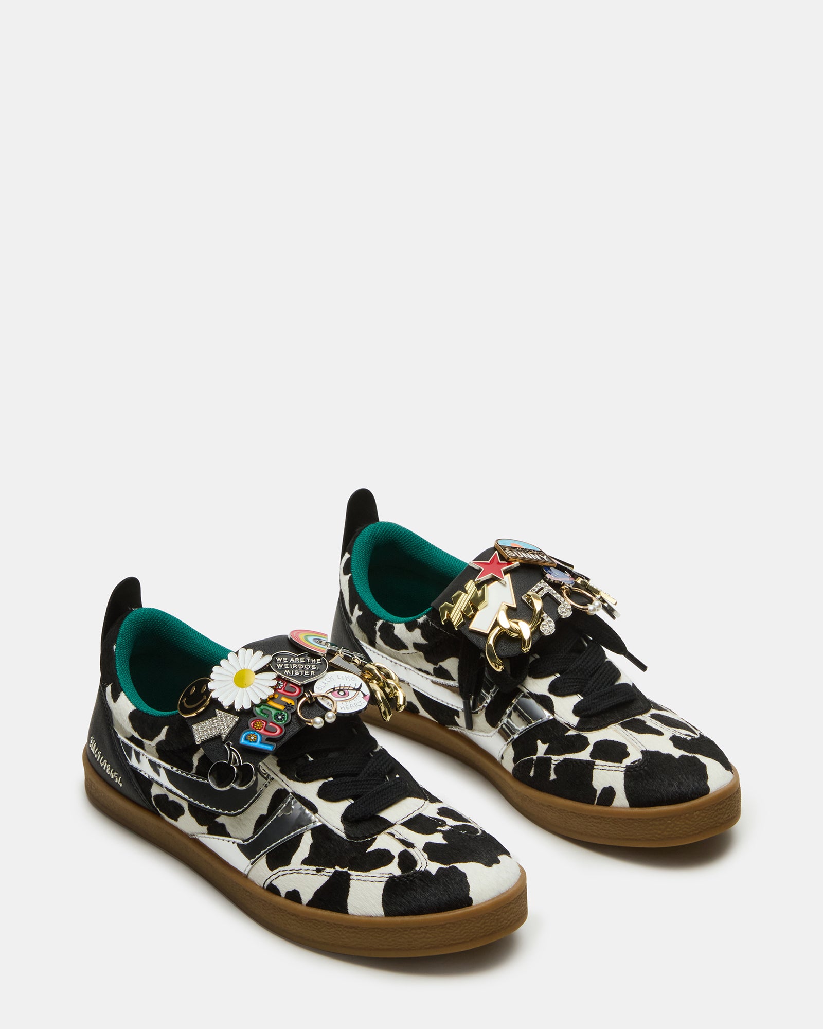 Side angle of Custom Wyatt Sneakers highlighting the cow print design