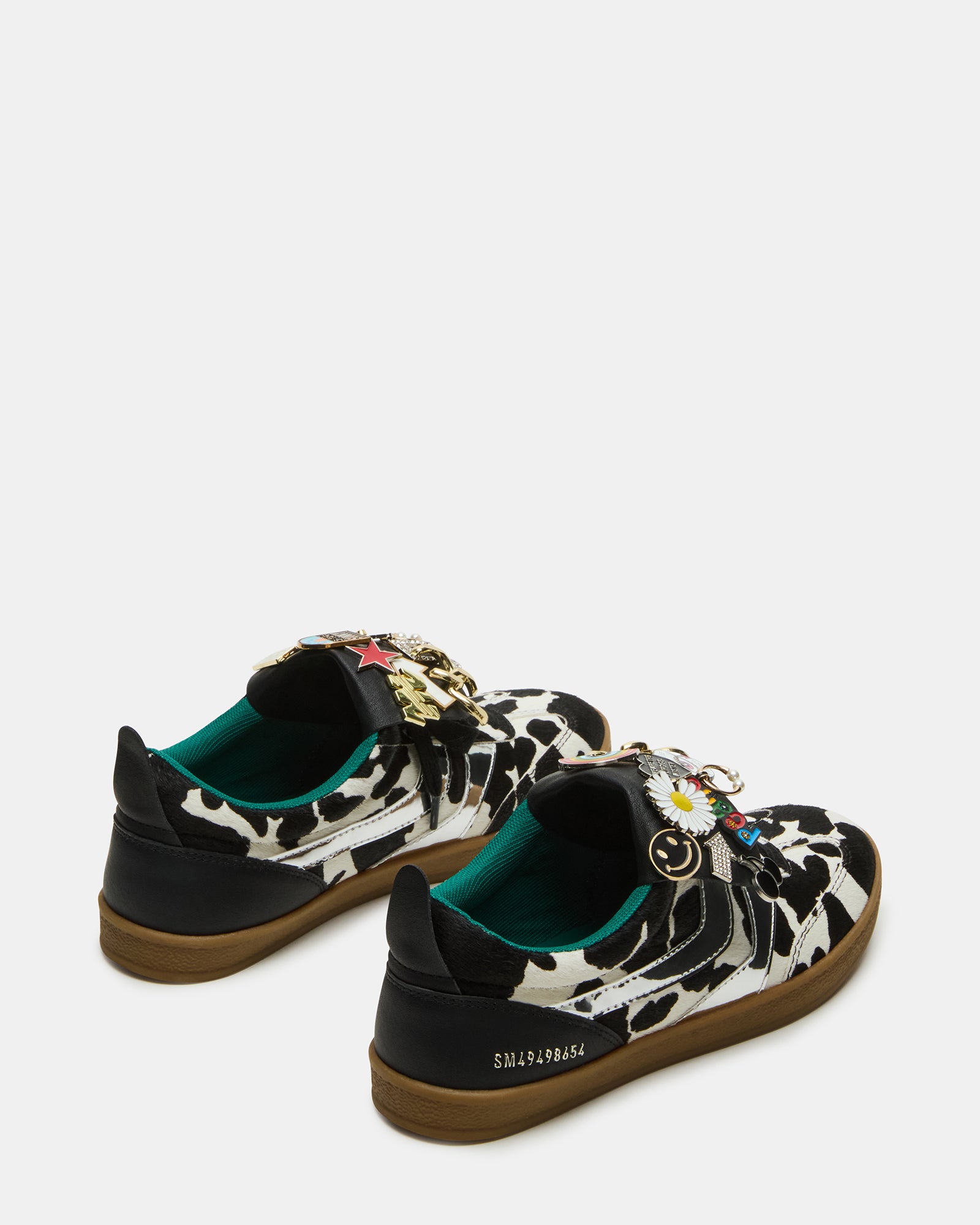 Side angle of Custom Wyatt Sneakers highlighting the cow print design