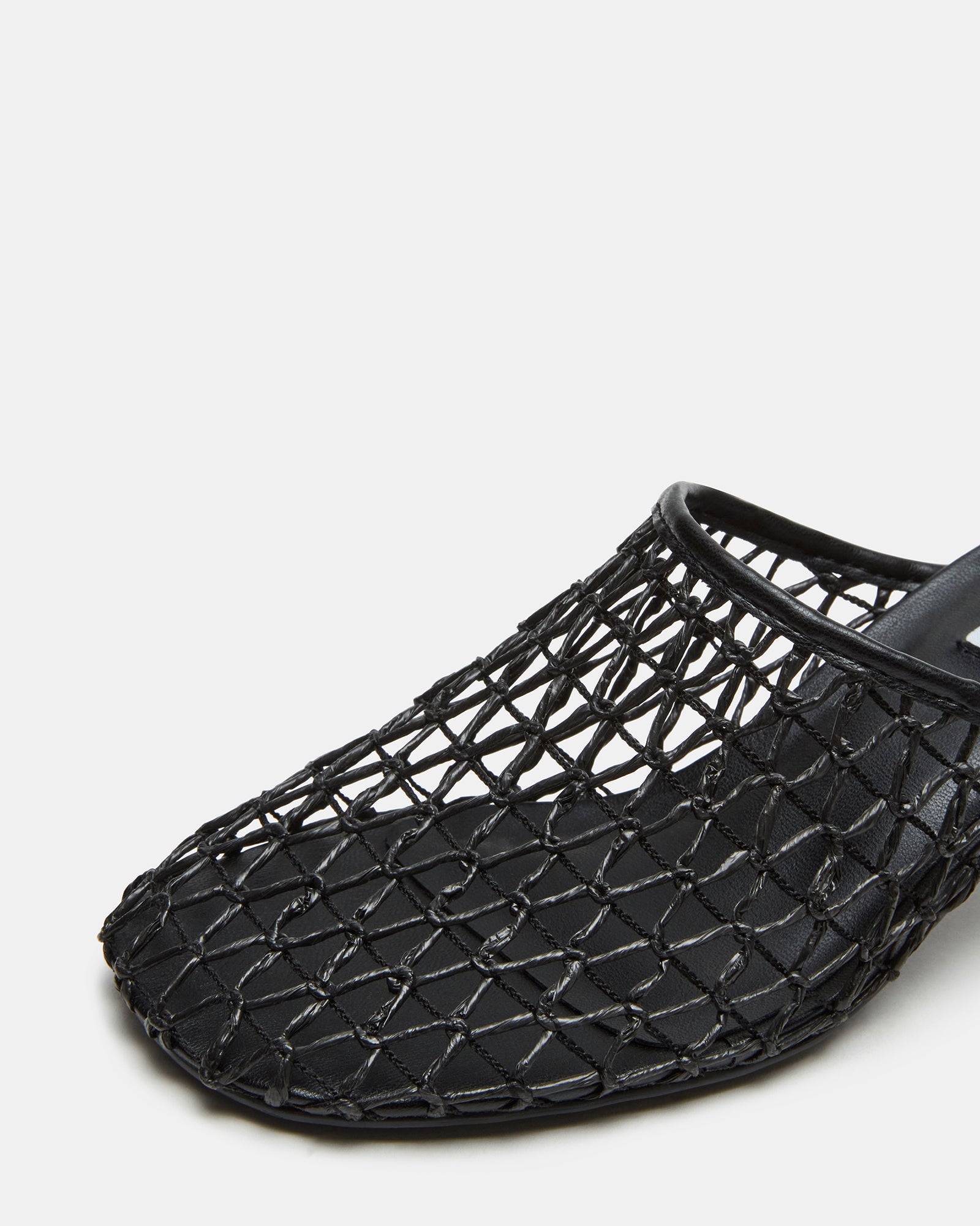 Model wearing XRAY Black mule shoes in a chic outfit, perfect for outings.