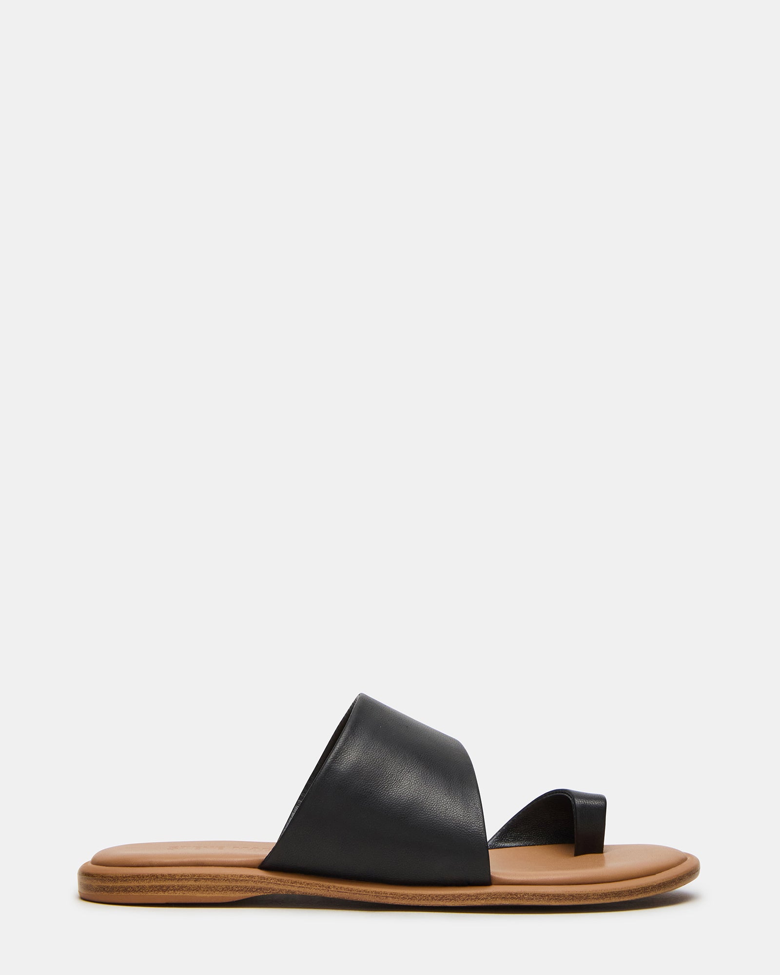 Zani black leather sandals styled with white linen pants for summer outfits