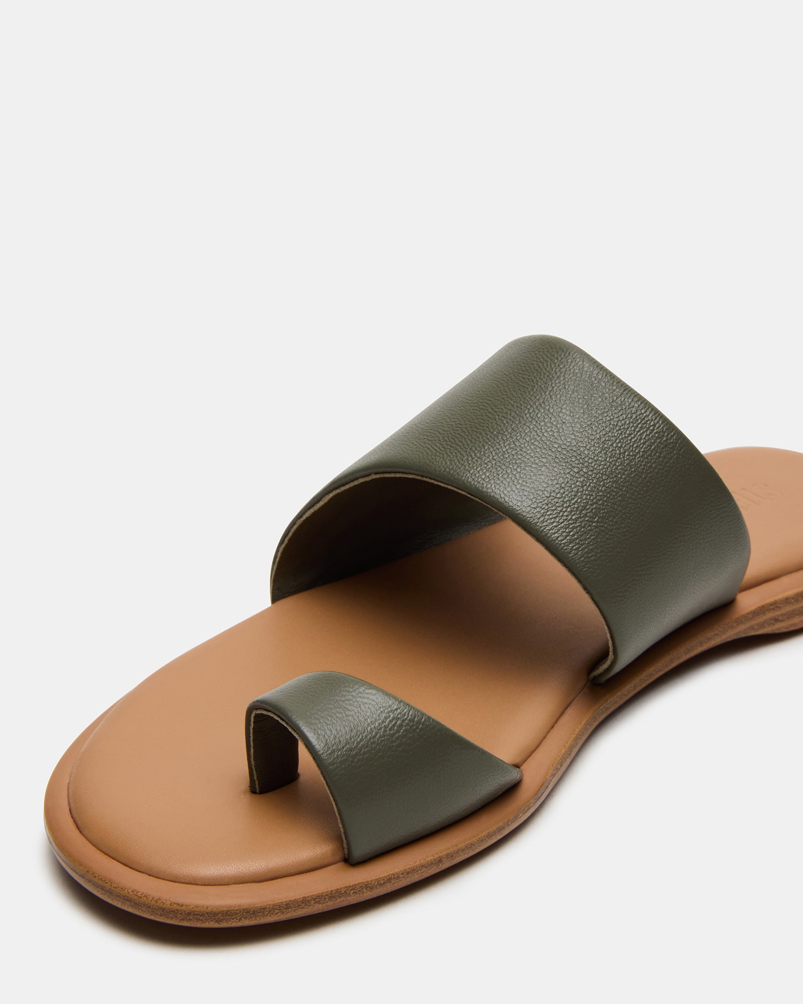 Close-up of the leather texture and craftsmanship on Zanis olive flat sandals
