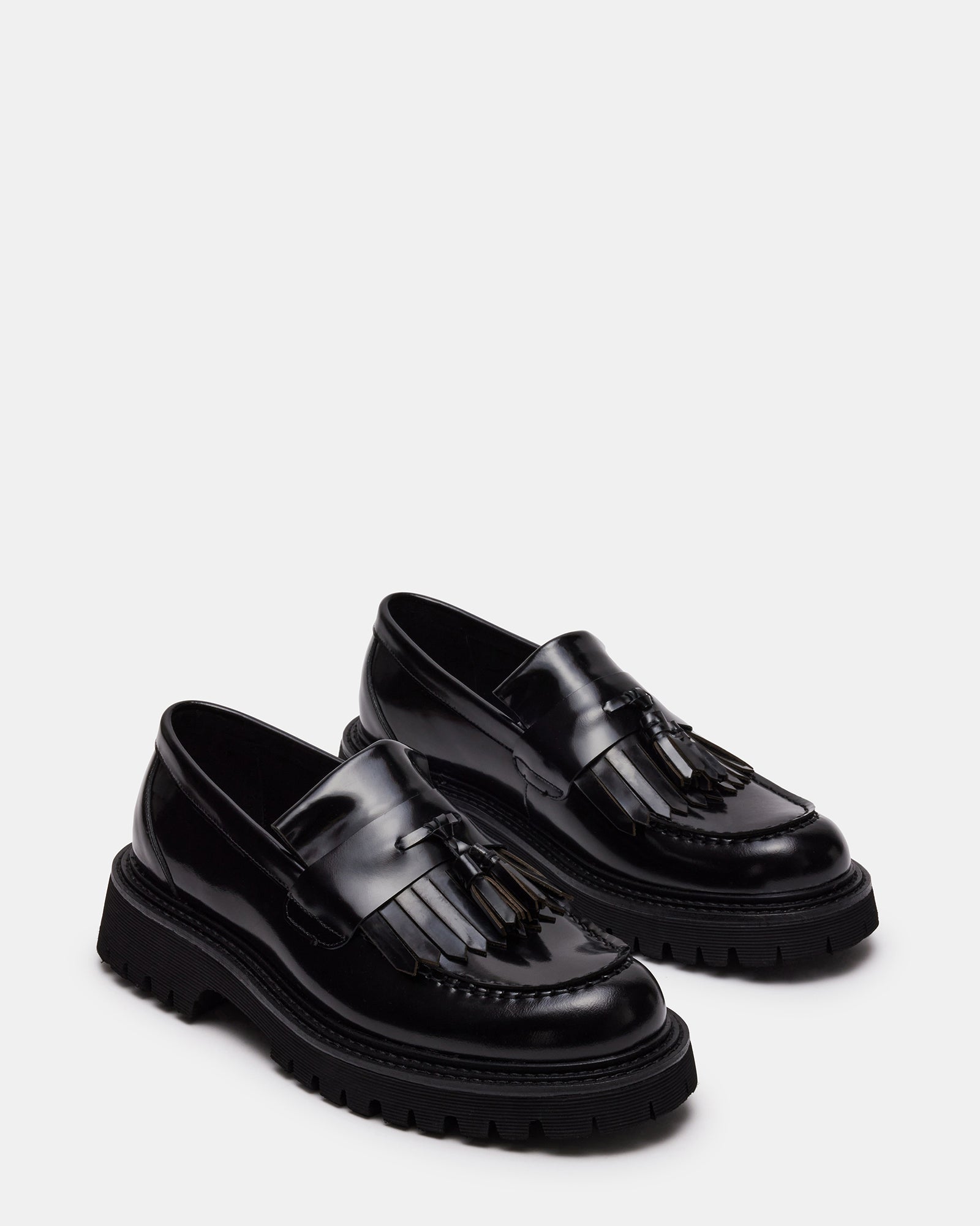 Close-up of premium leather stitching and tassel design on ZEV loafers.