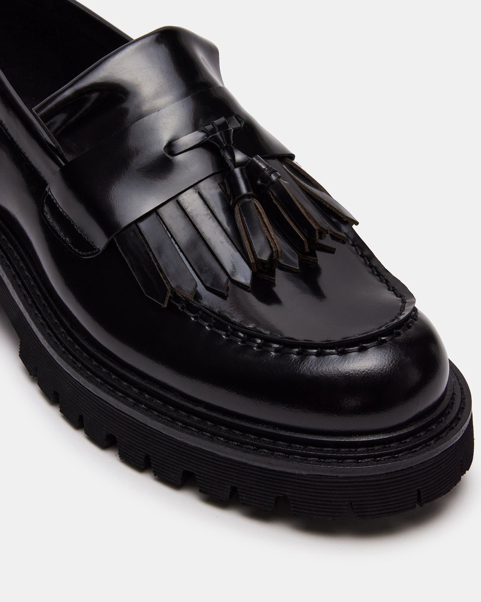 Ivory cotton crew socks paired with black loafers for a polished casual look.