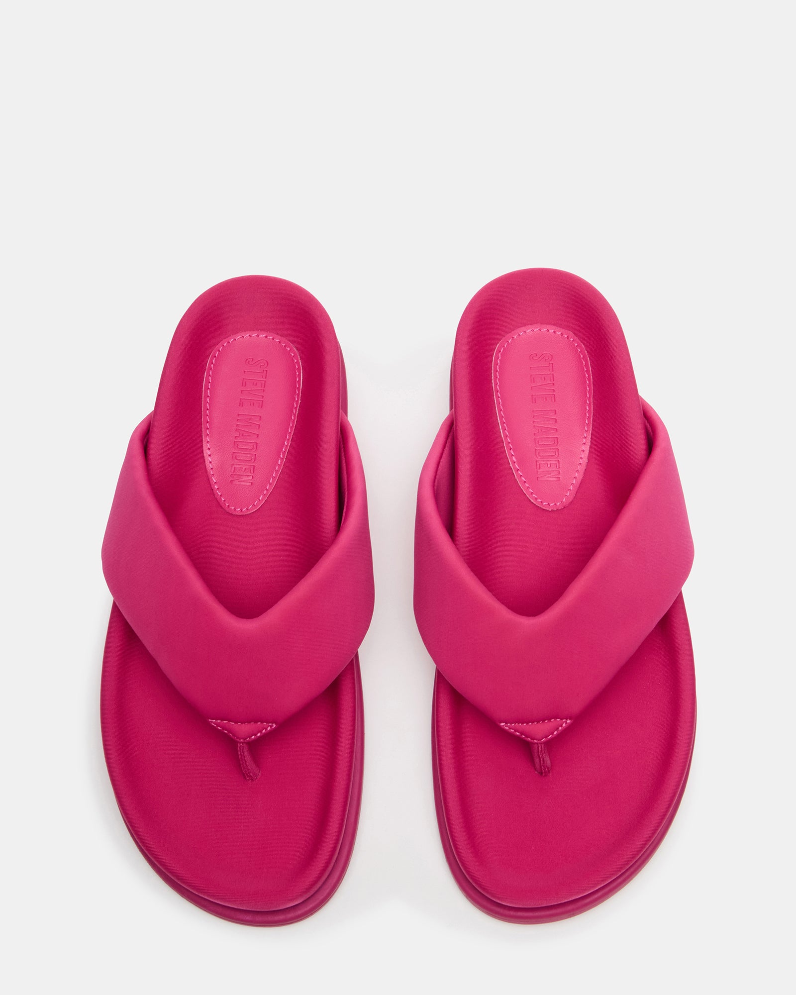Side view of pink thong heeled sandals with 1-inch heel, ideal for casual wear