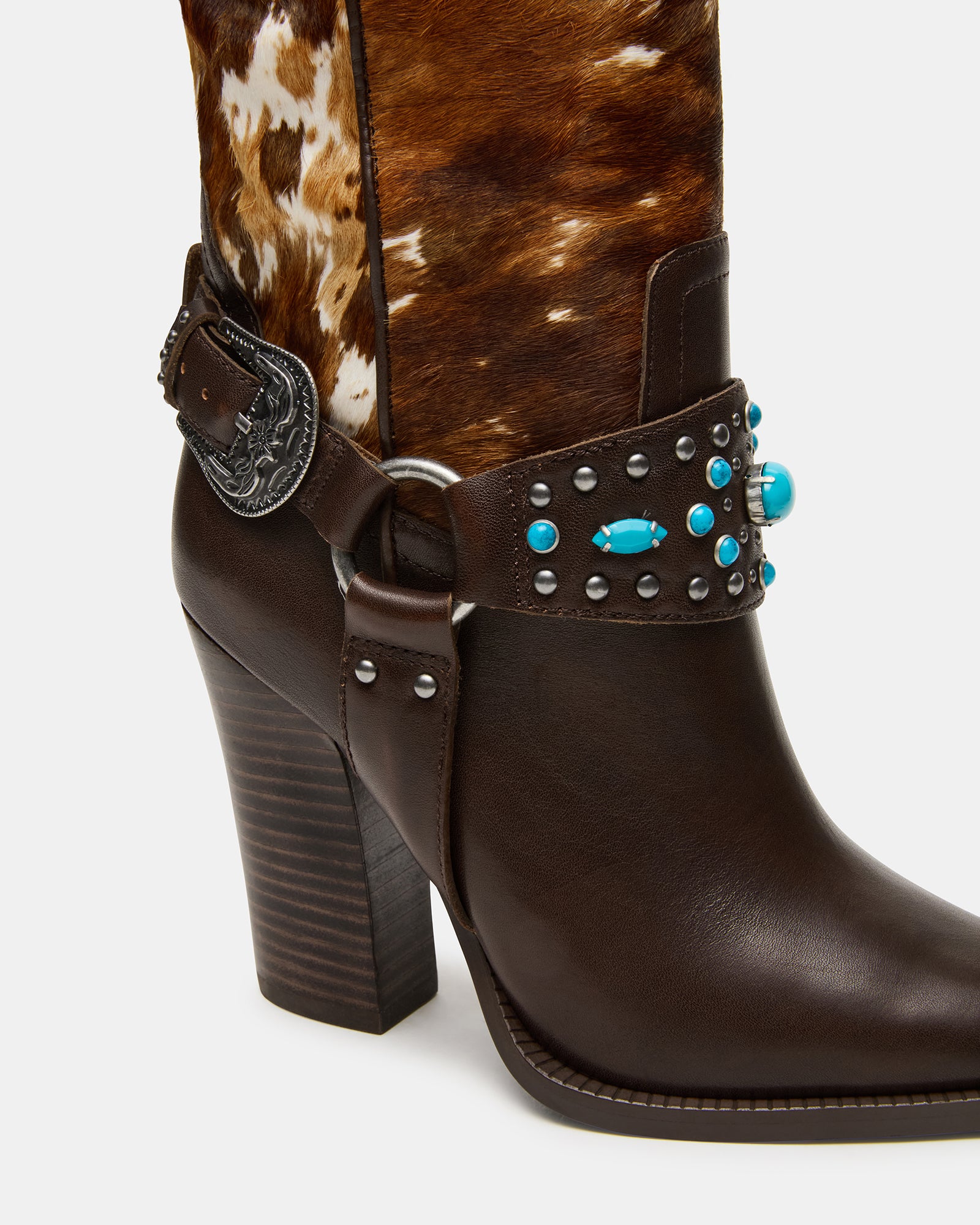 Model wearing leather boots downtown for casual wear